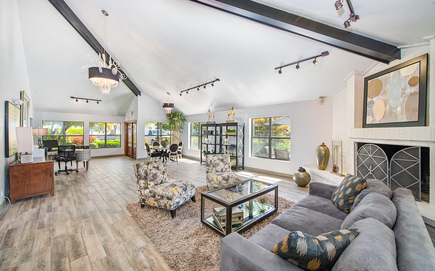 a living room with a large couch and a fireplace