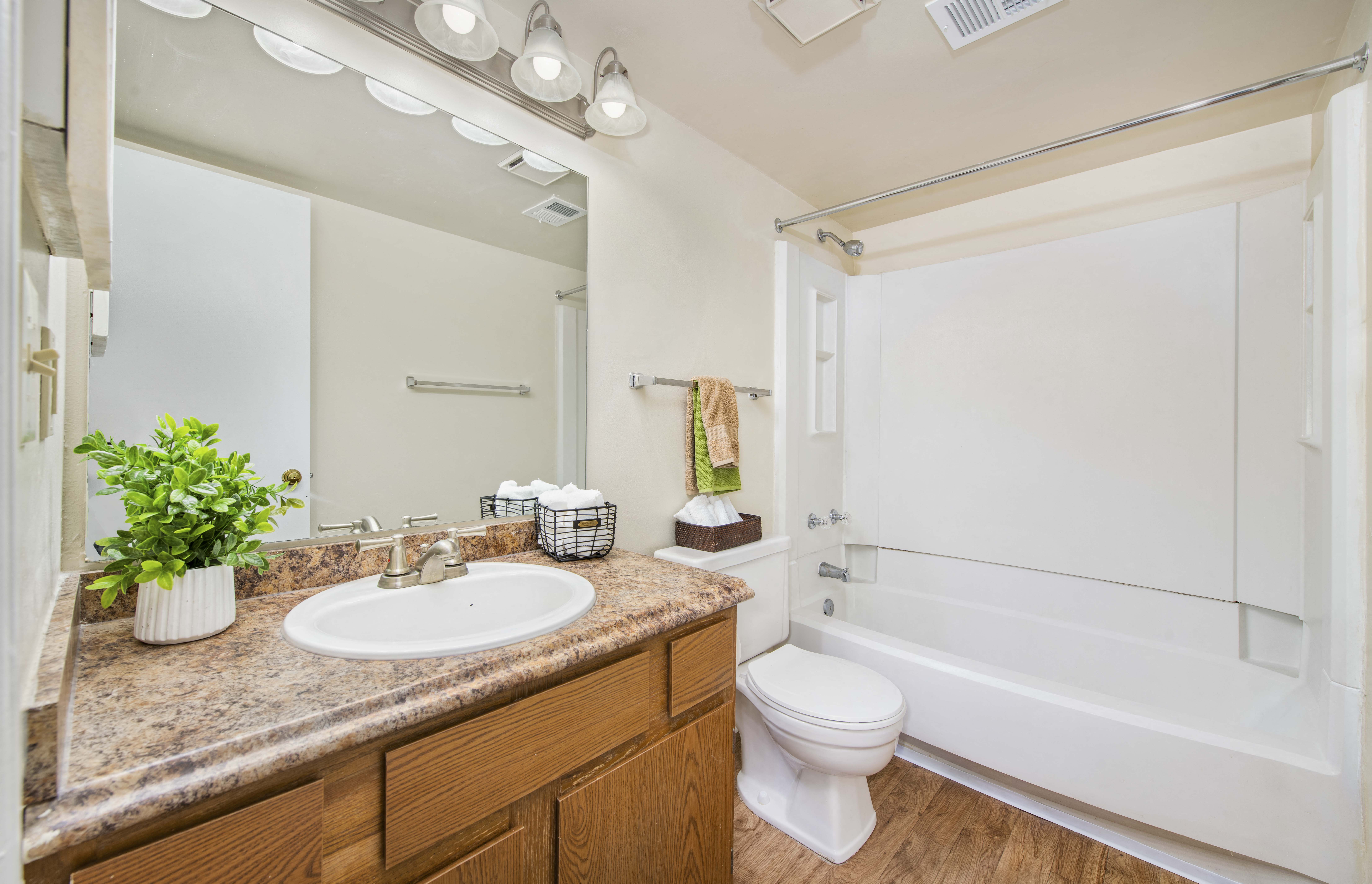 a bathroom with a sink toilet and a bath tub