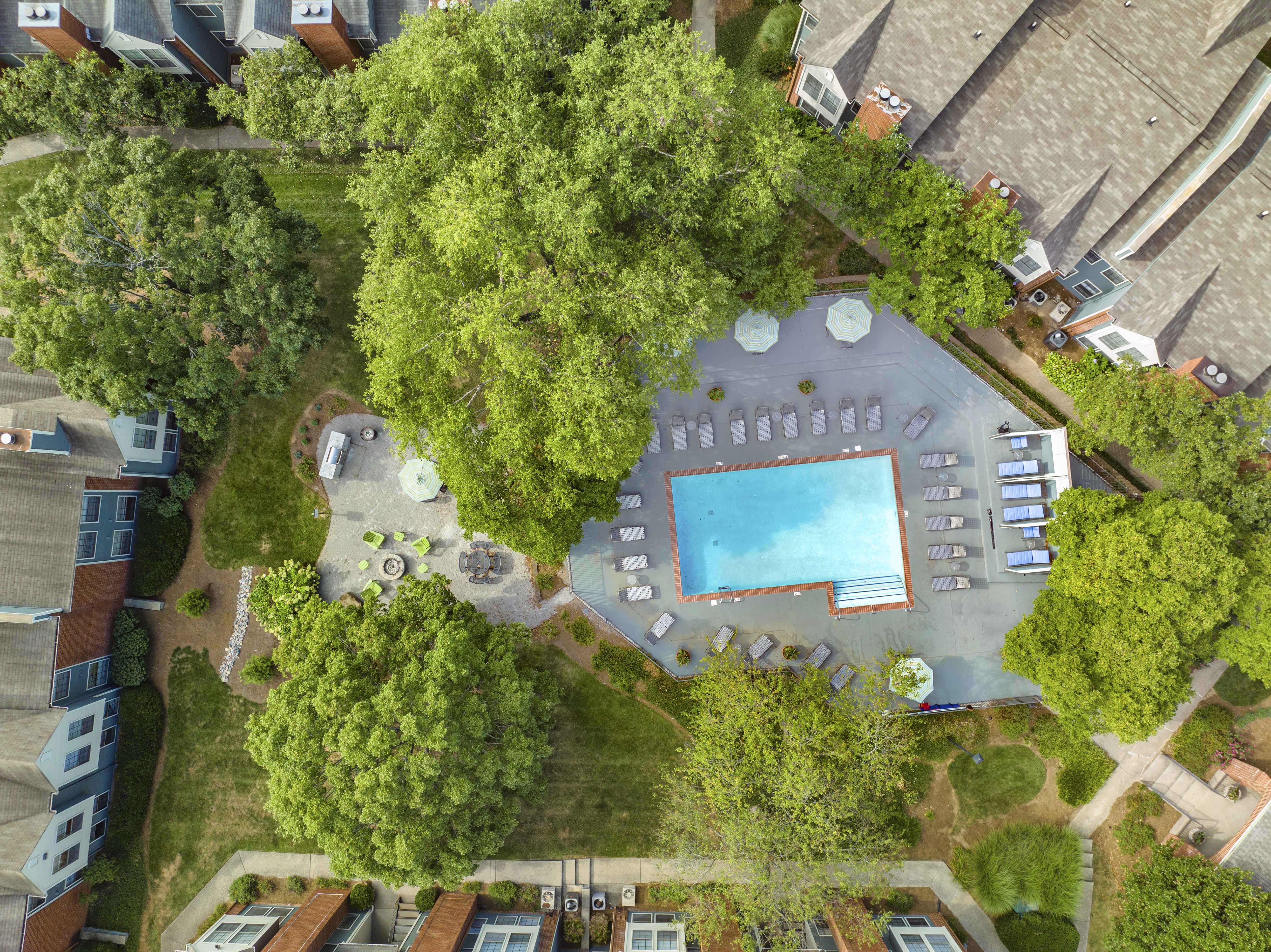 a birds eye view of a pool in the backyard of a house