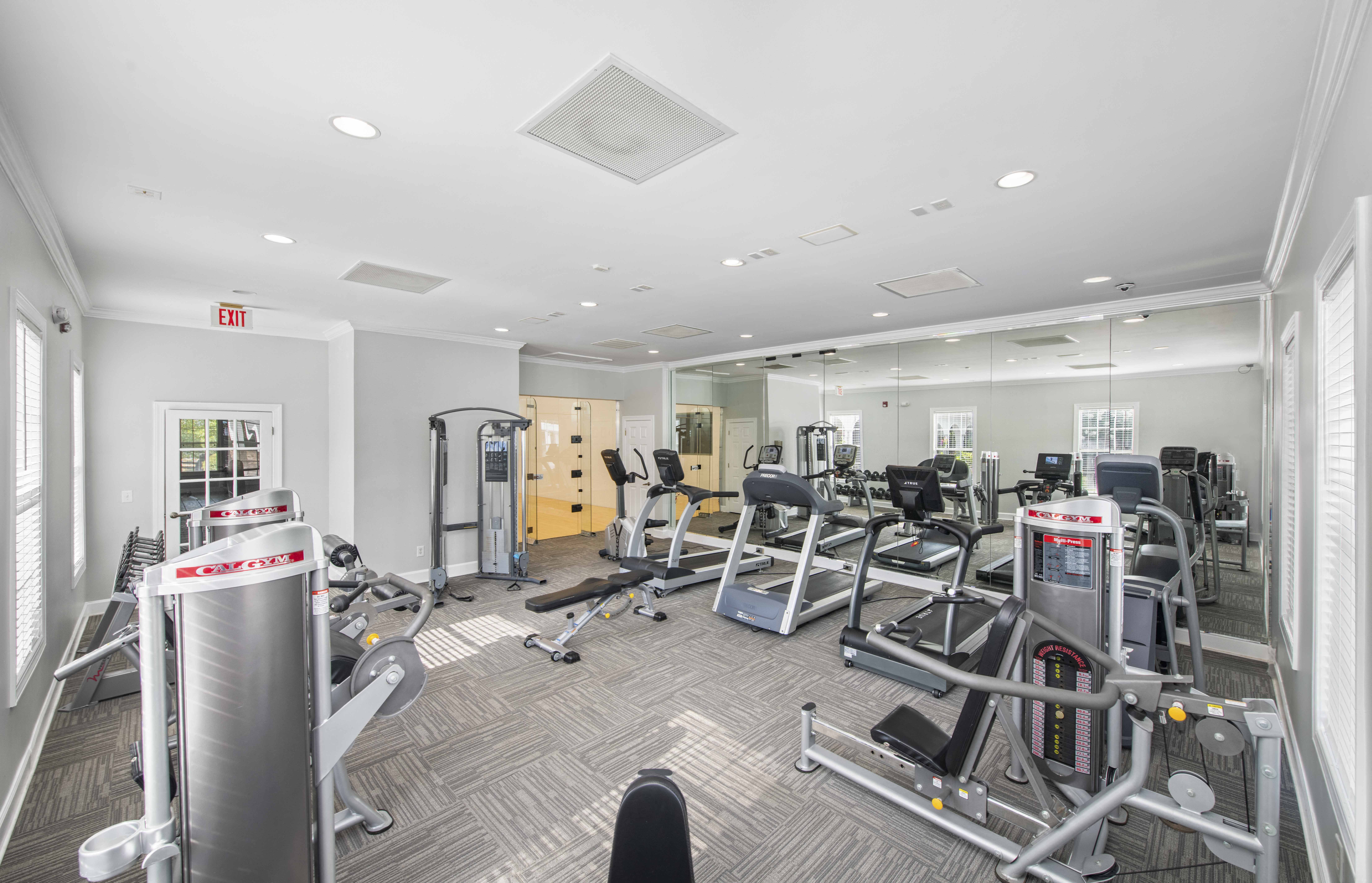 the gym is equipped with state of the art equipment including cardio machines and weights