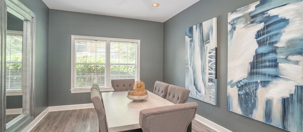 a dining room with a table and chairs