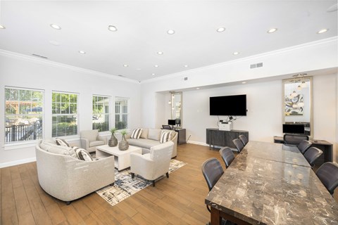 a living room with couches and chairs and a table