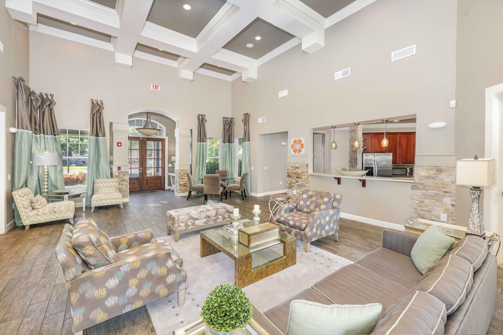 a living room with couches and chairs and a table