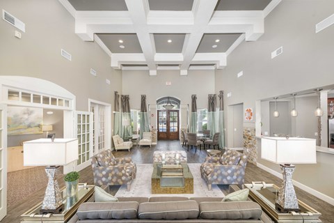 a large living room with couches and a table