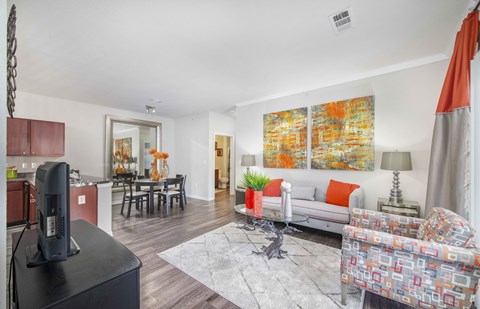 a living room with a couch and a tv