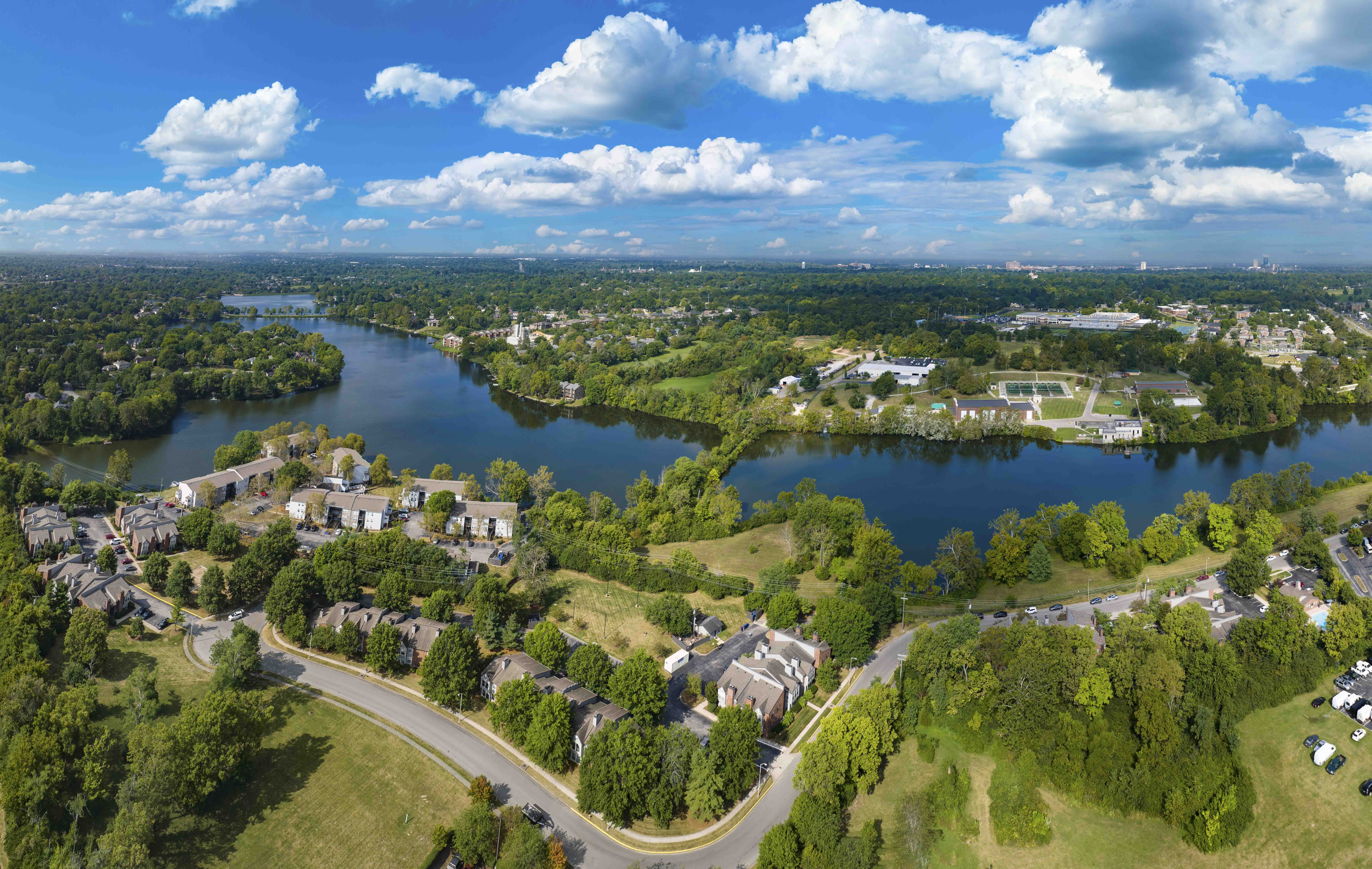 an aerial view of a neighborhood with lakes and houses
