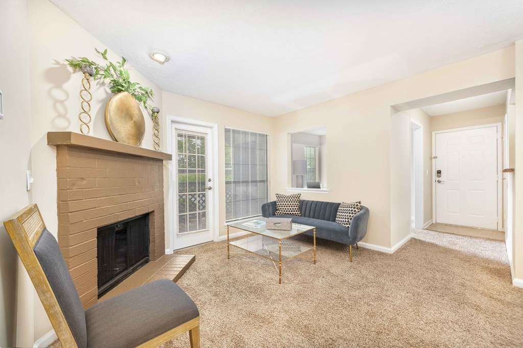 a living room with a fireplace and a couch