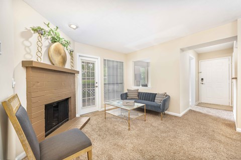 a living room with a fireplace and a couch