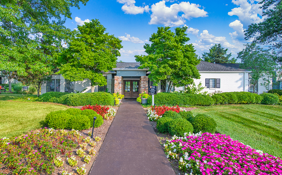 a house with a garden in front of it
