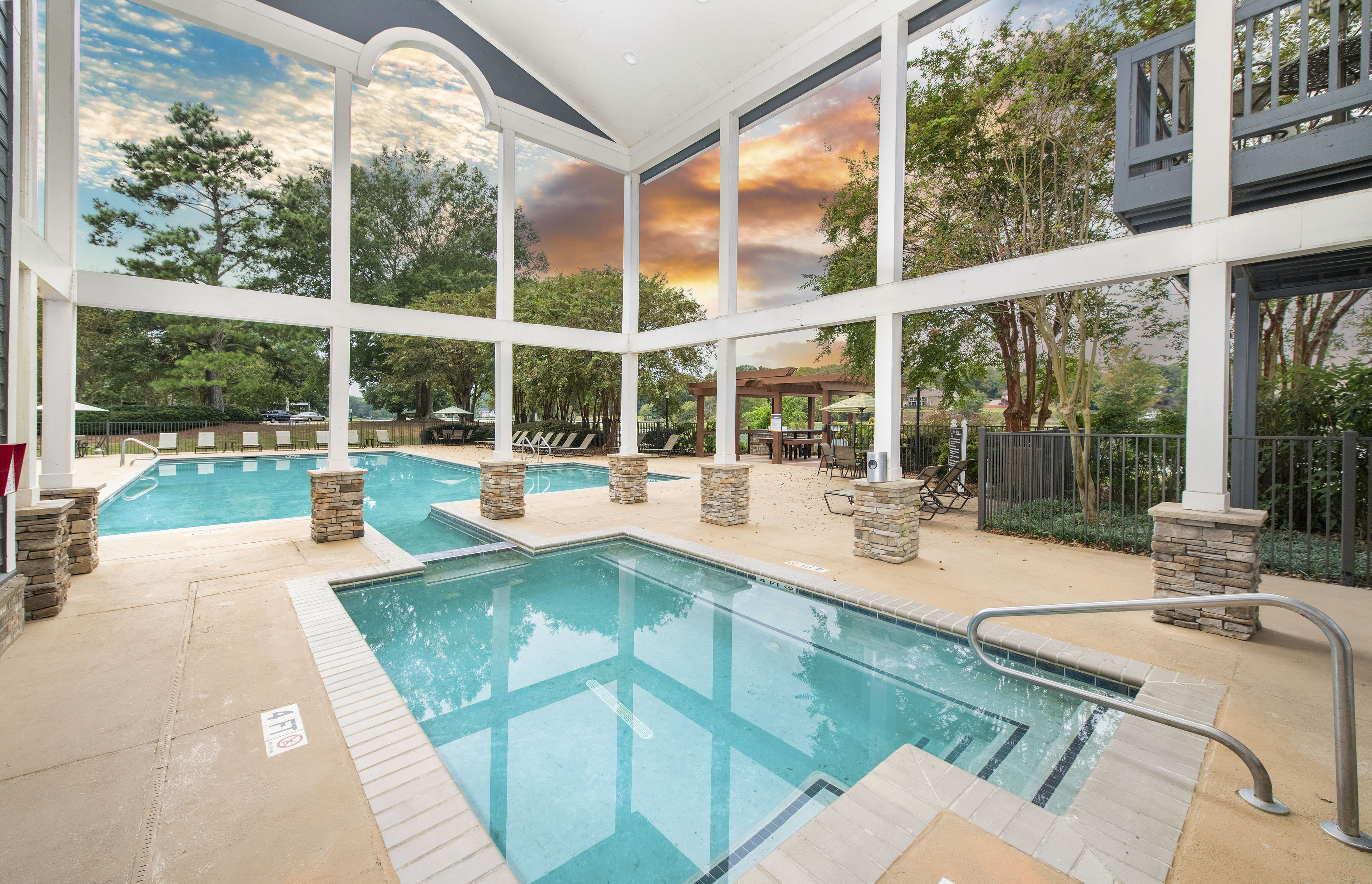 the swimming pool at the estates apartments