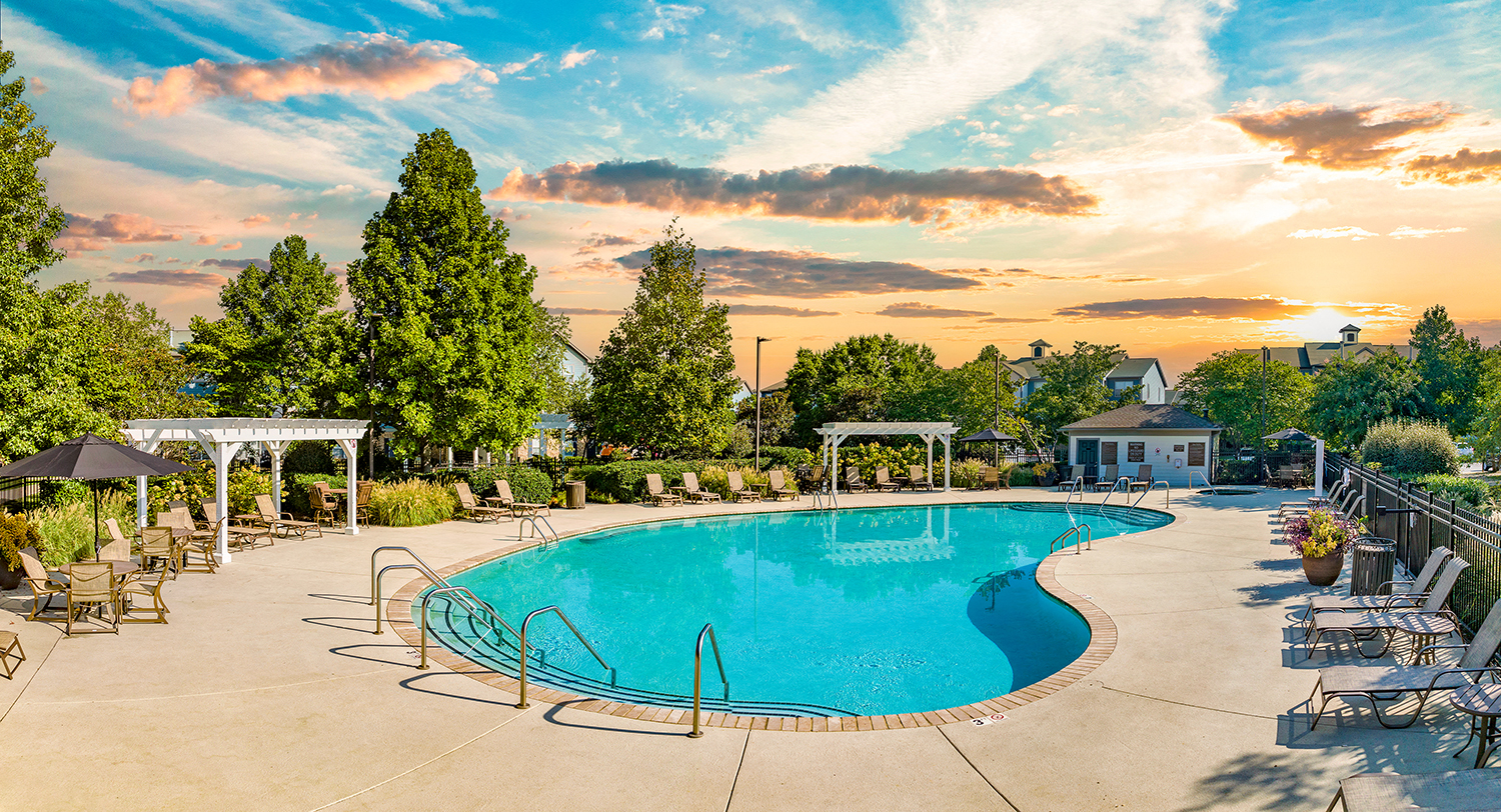 the community pool at sunset at our apartments