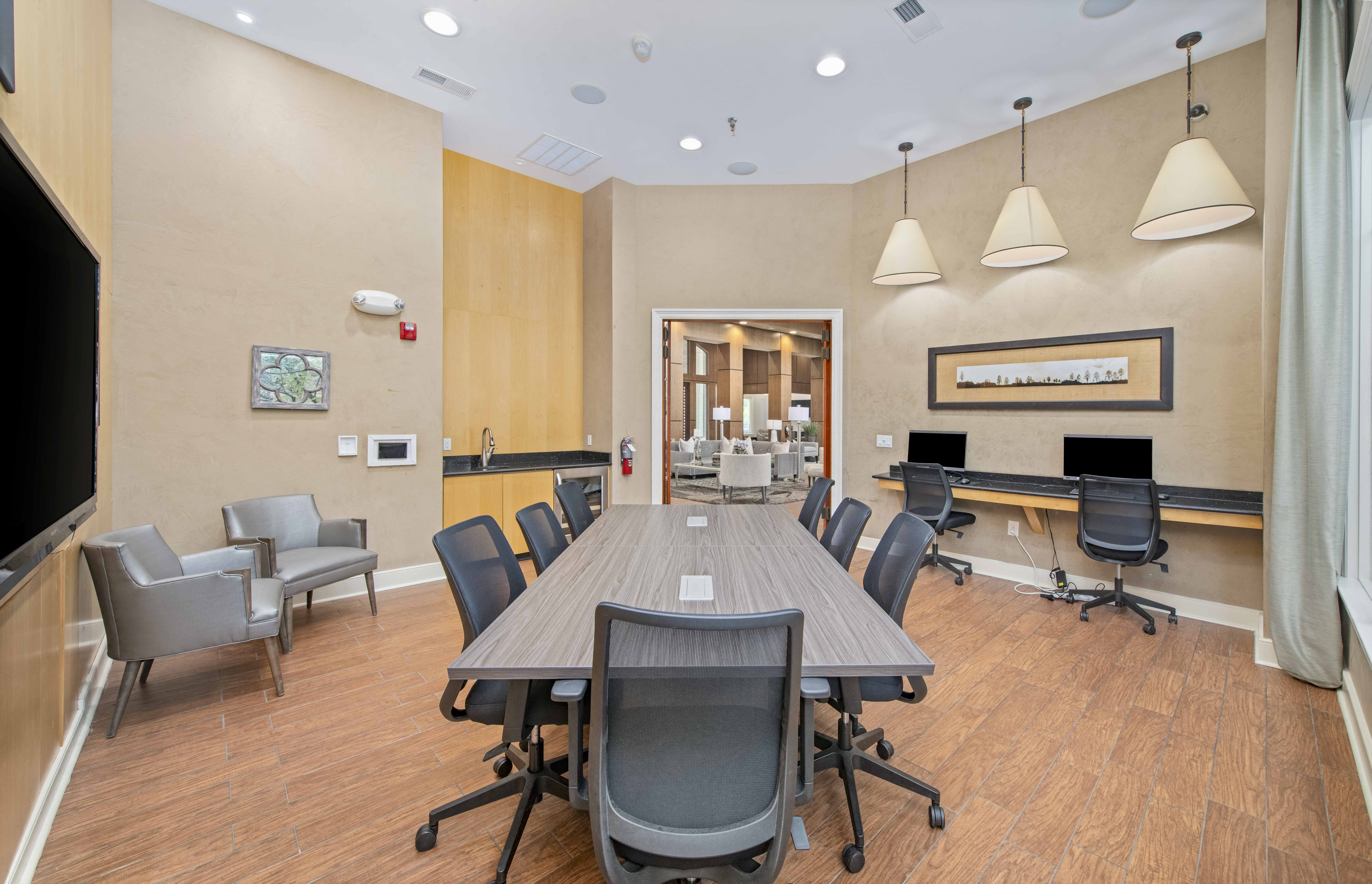 a conference room with a large table and chairs