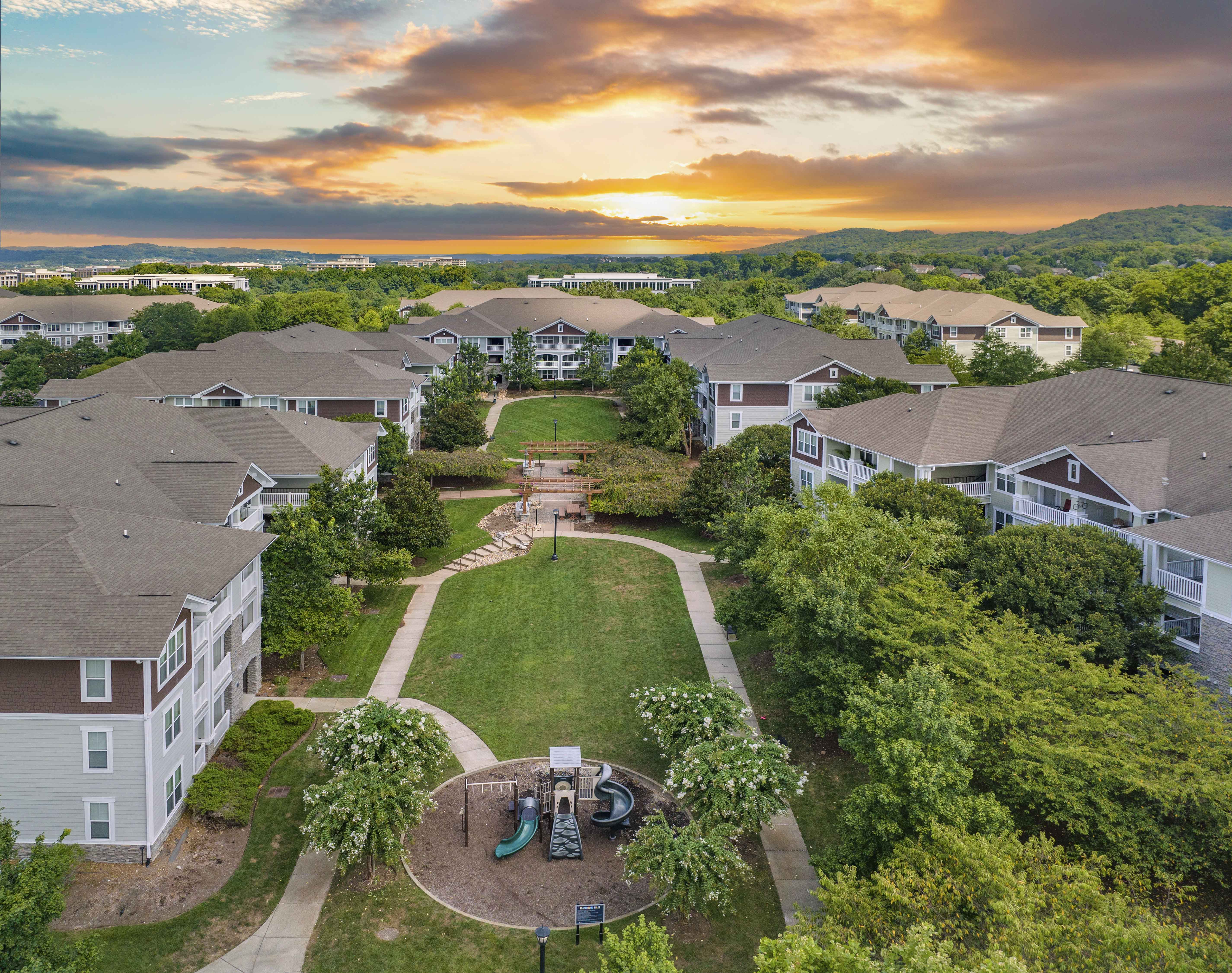 an aerial view of a neighborhood with houses and a playground
