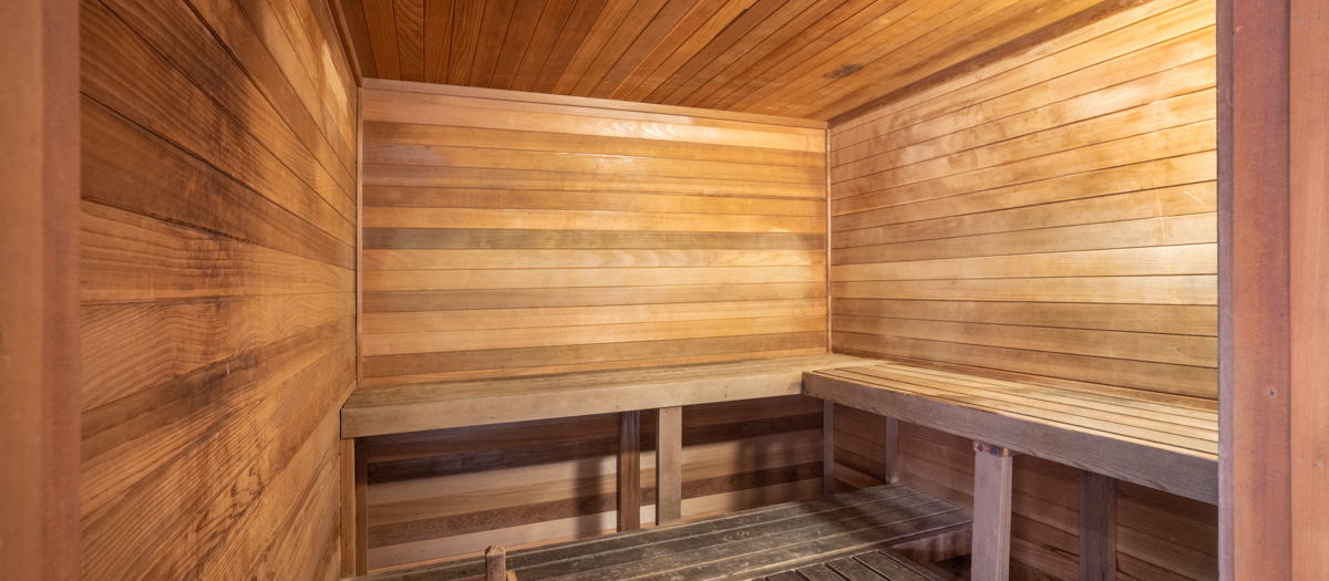 a sauna with wooden walls and wooden benches