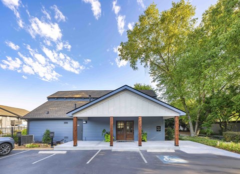 A building with a parking lot in front of it.
