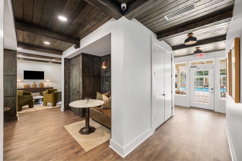 A room with a white table and chairs.