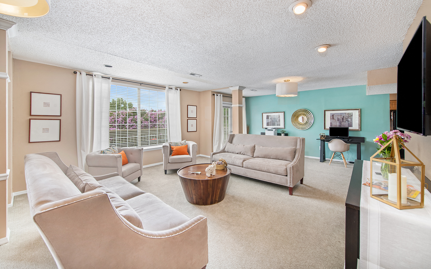 a living room with couches and chairs and a piano