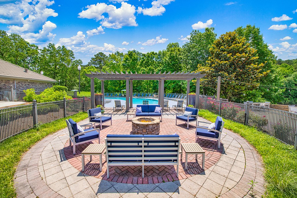 the preserve at ballantyne commons clubhouse with patio furniture and a pool