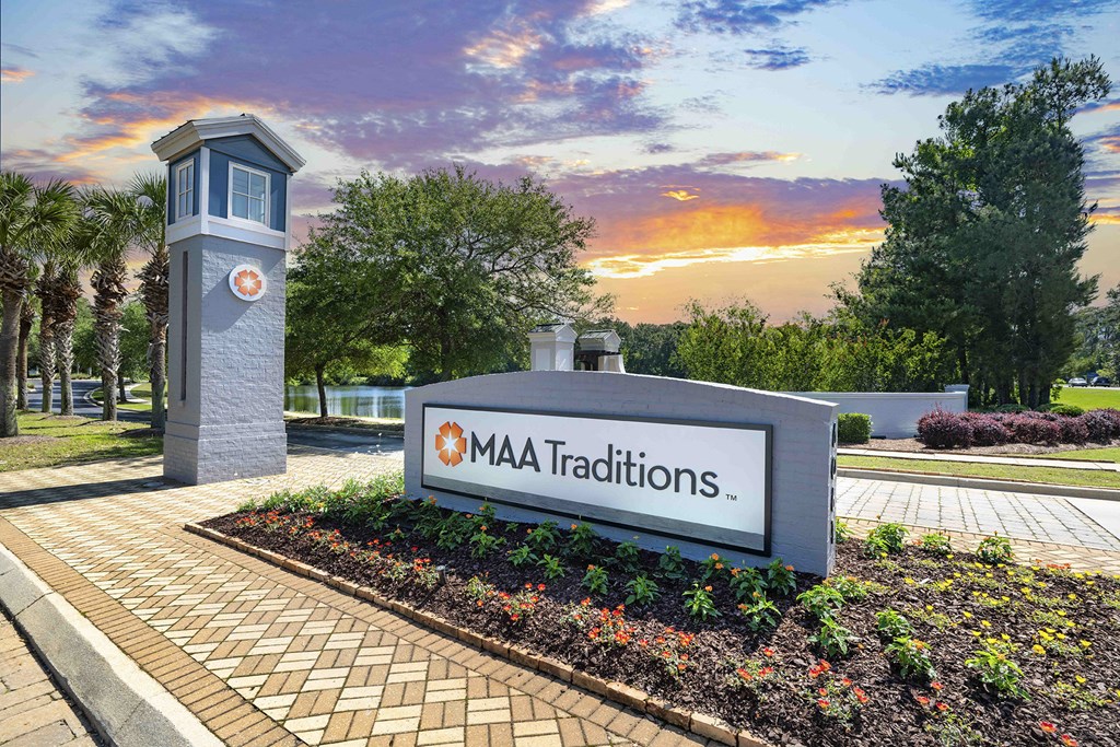 A sign that says MAATtraditions in front of a building.