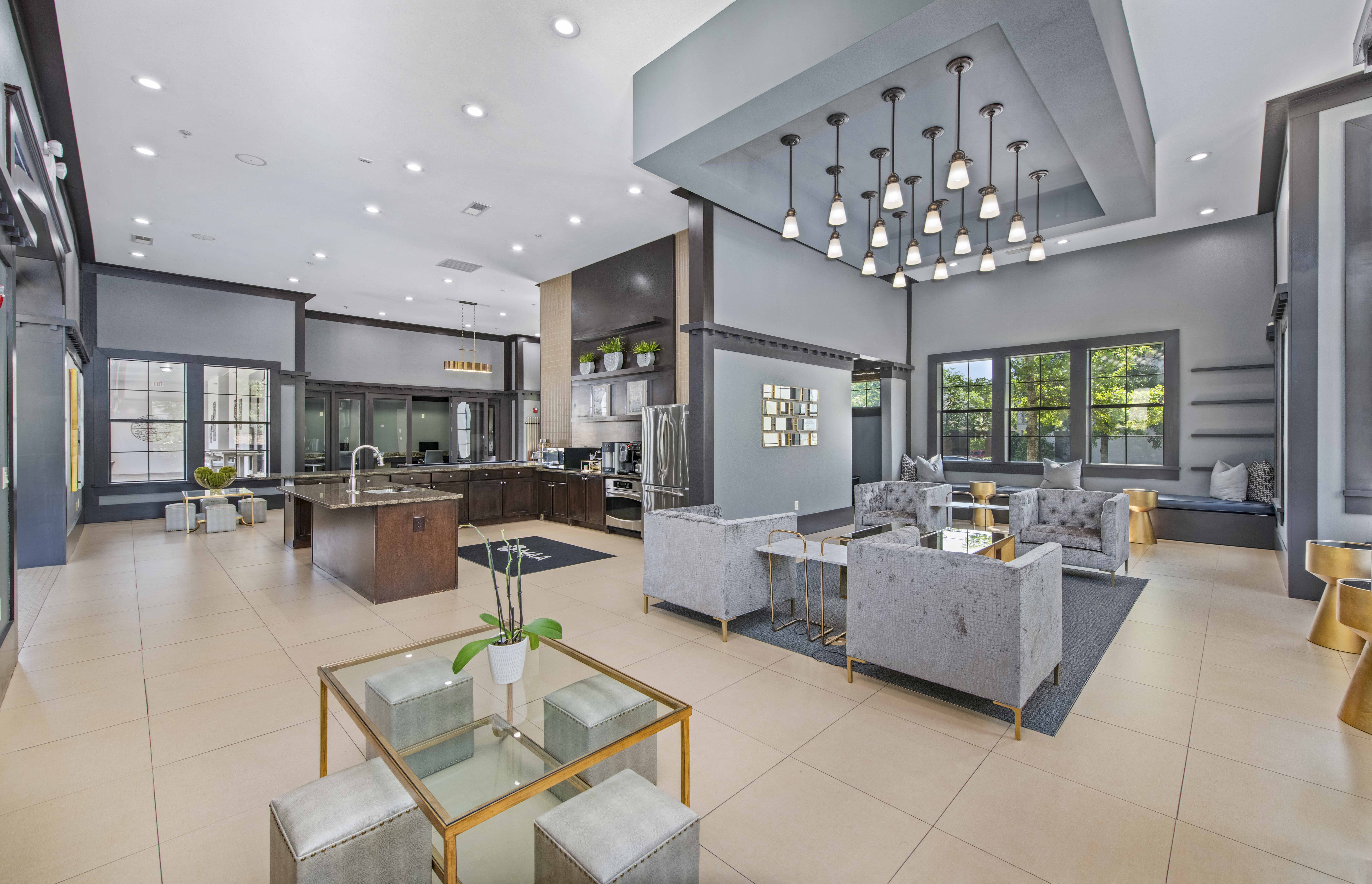 a living room with a kitchen and a dining room