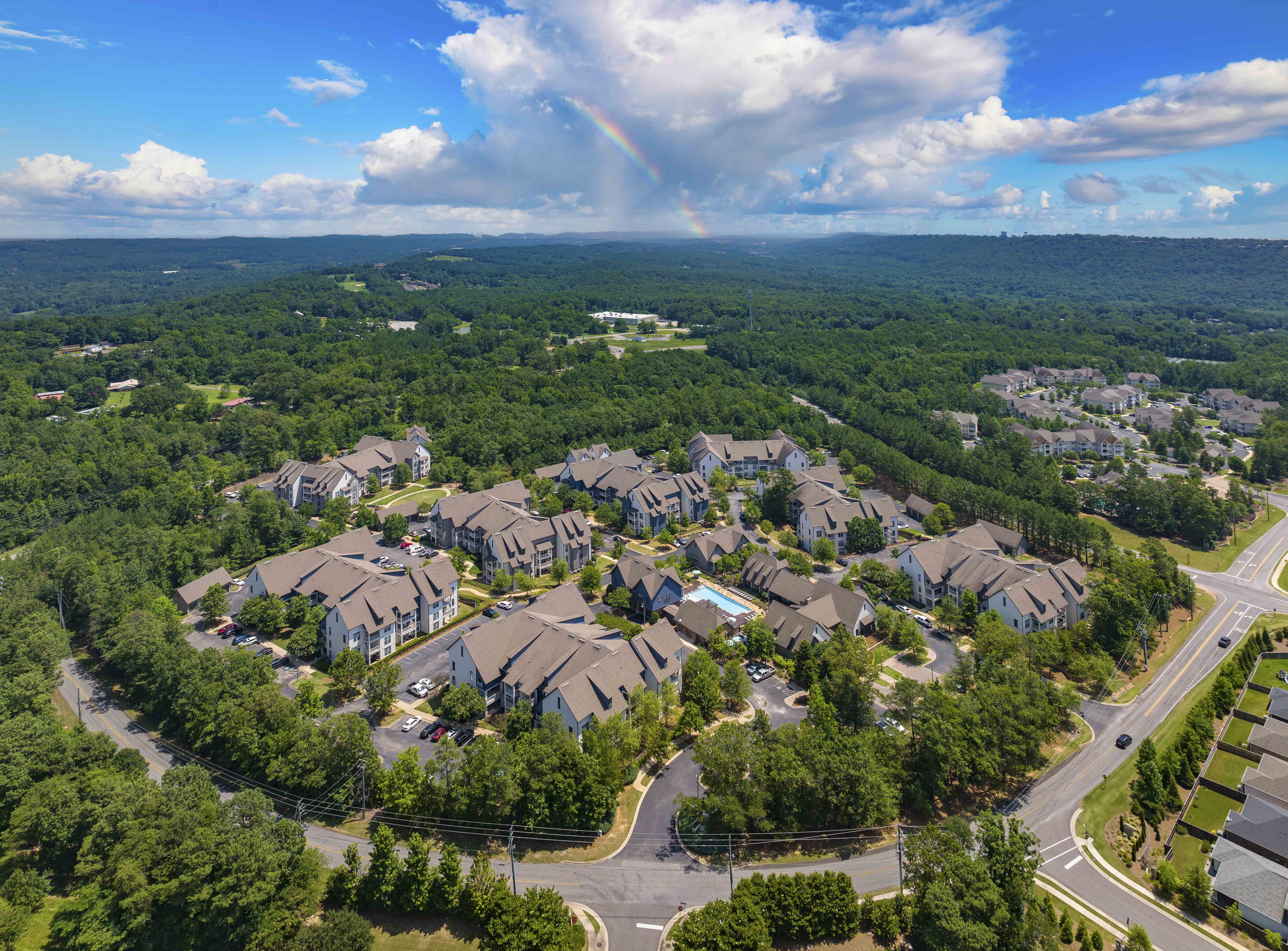 an aerial view of a neighborhood with houses and trees