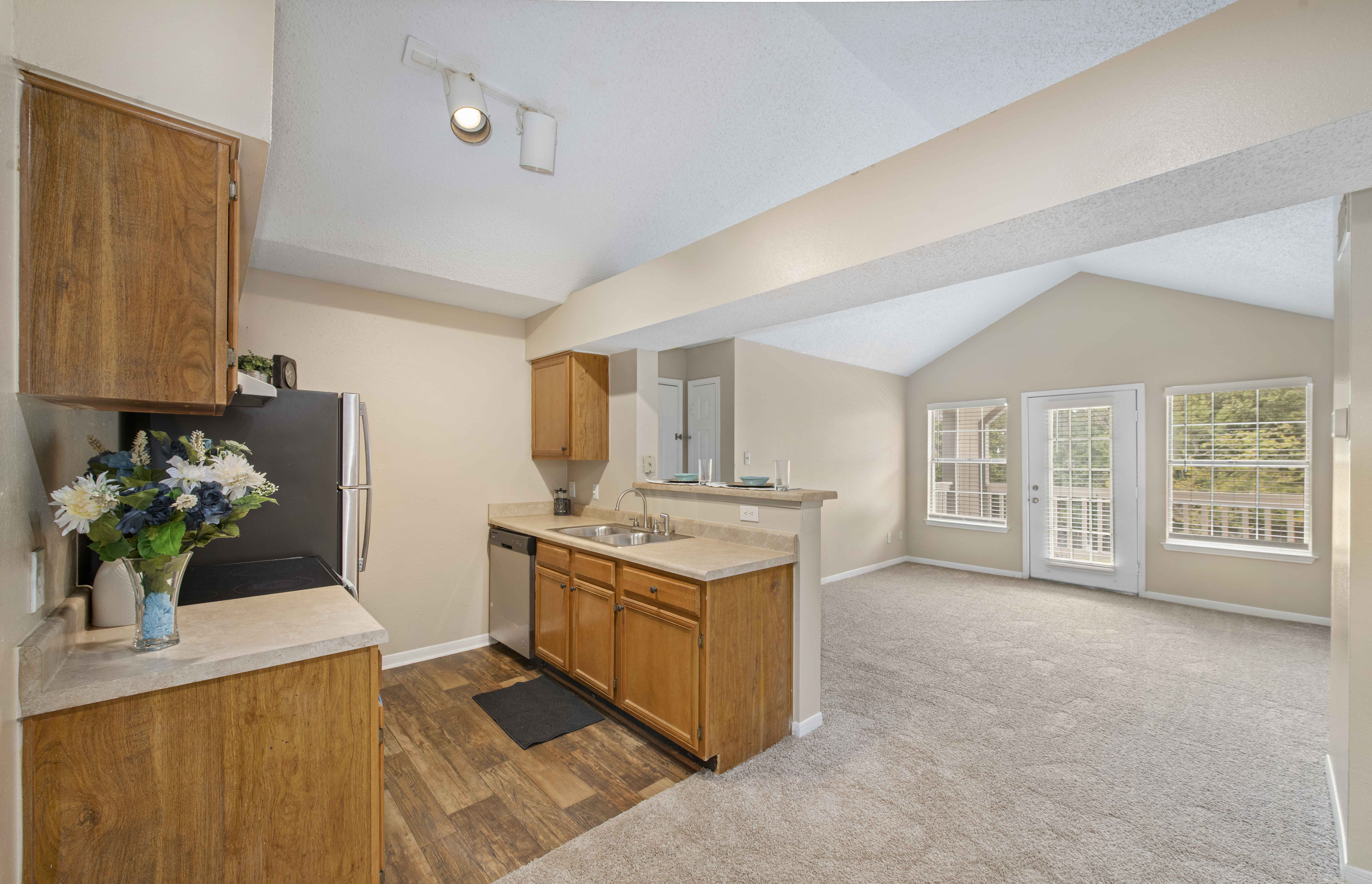 a kitchen with a sink and a refrigerator