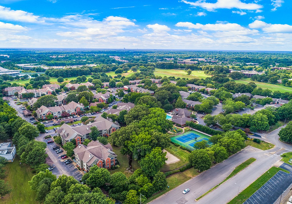 an aerial view of a neighborhood with houses and a swimming pool
