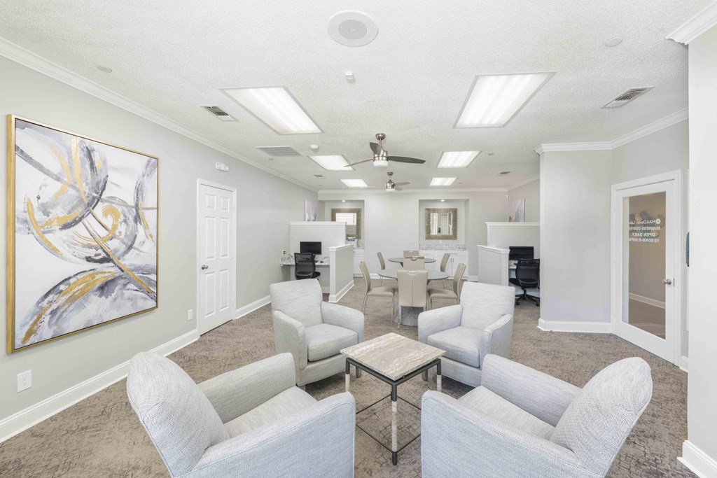 a waiting room with chairs and a table