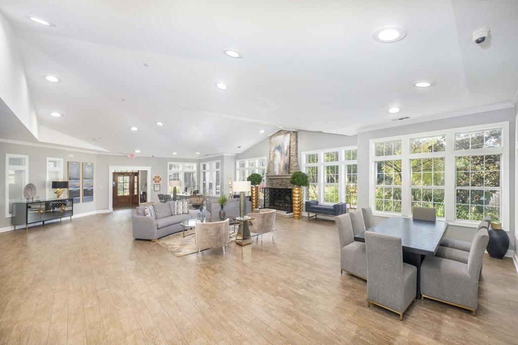 a living room with couches and chairs and a fireplace