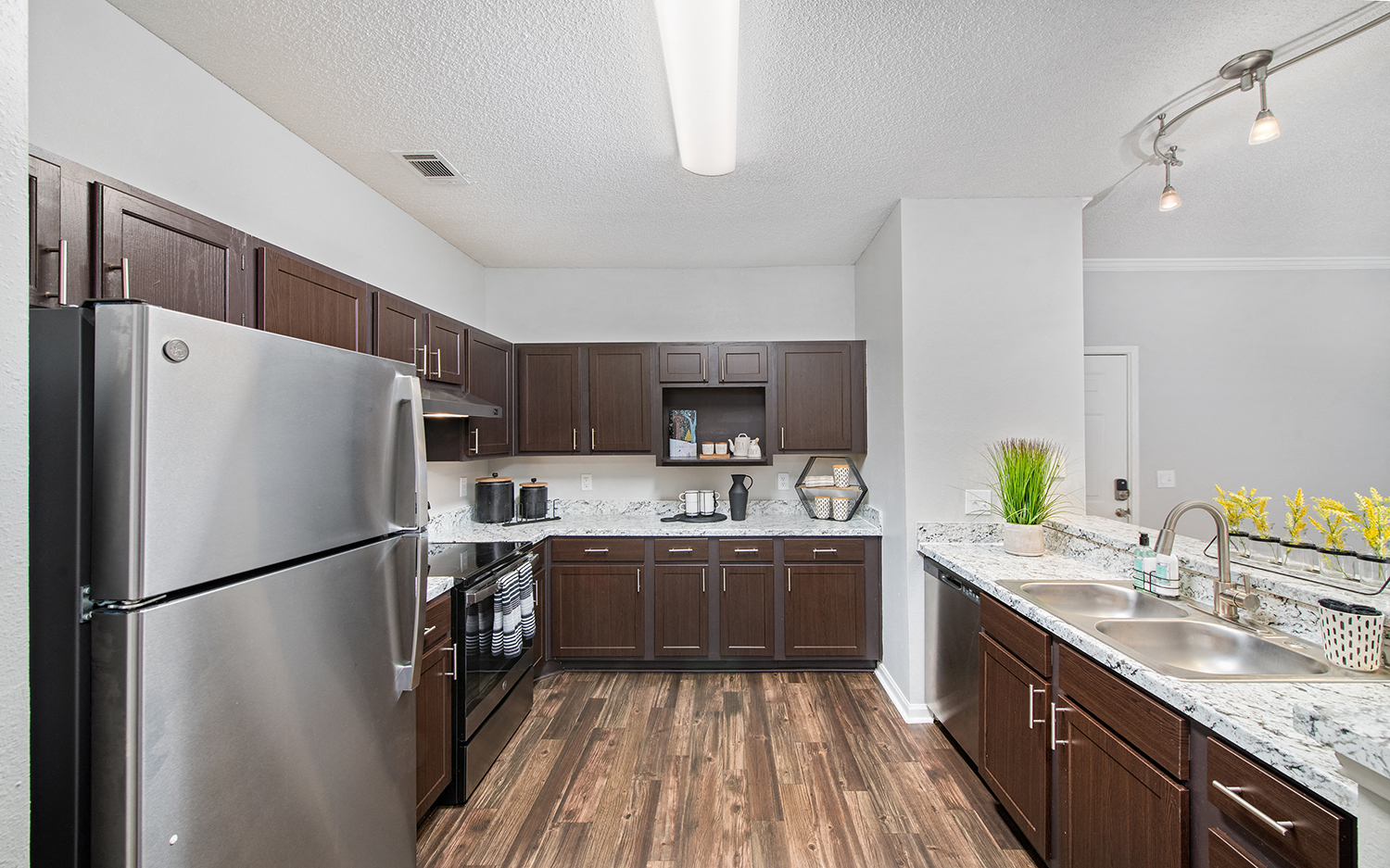 our spacious kitchen is equipped with stainless steel appliances and granite counter tops