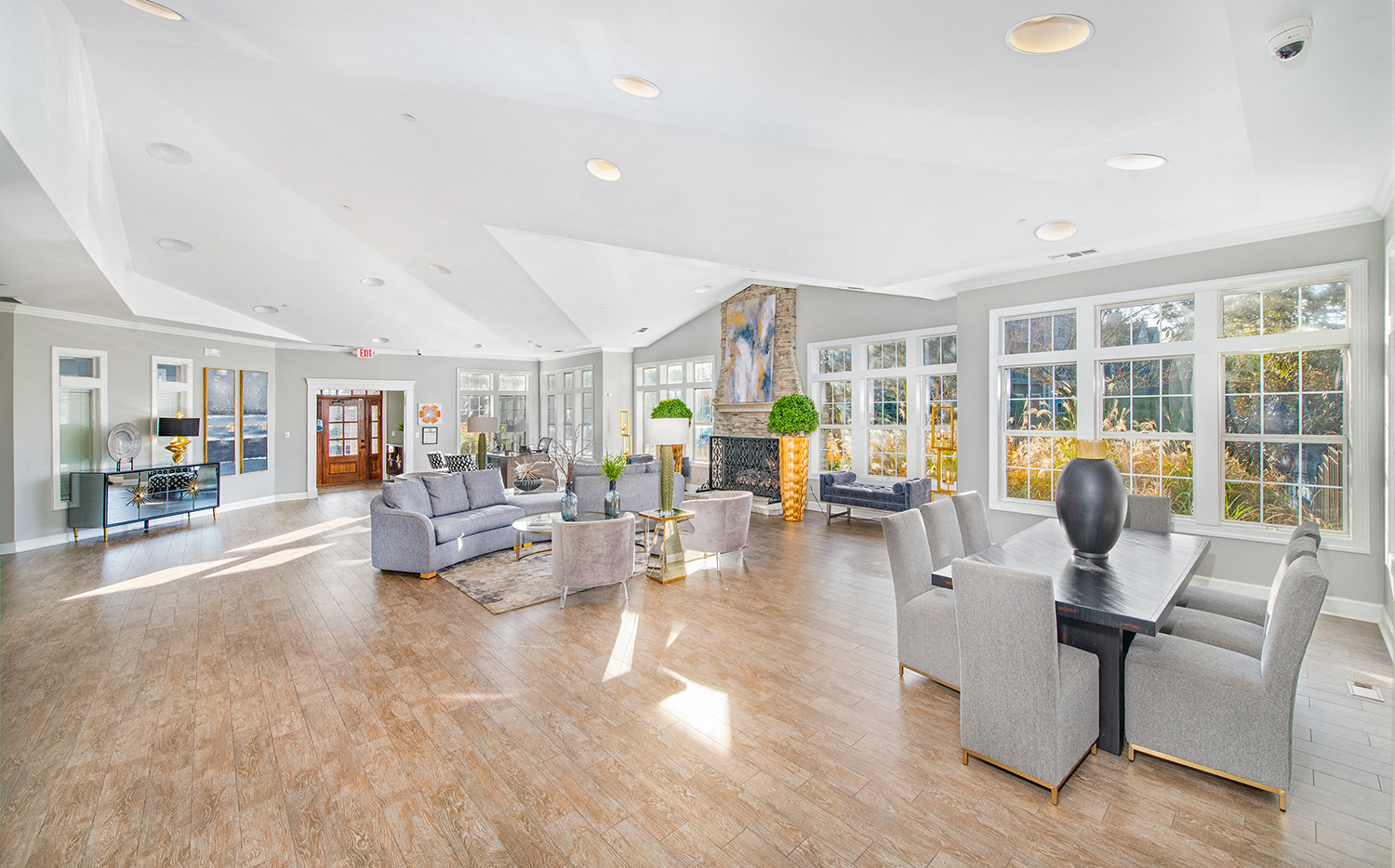 a living room with couches and chairs and a table