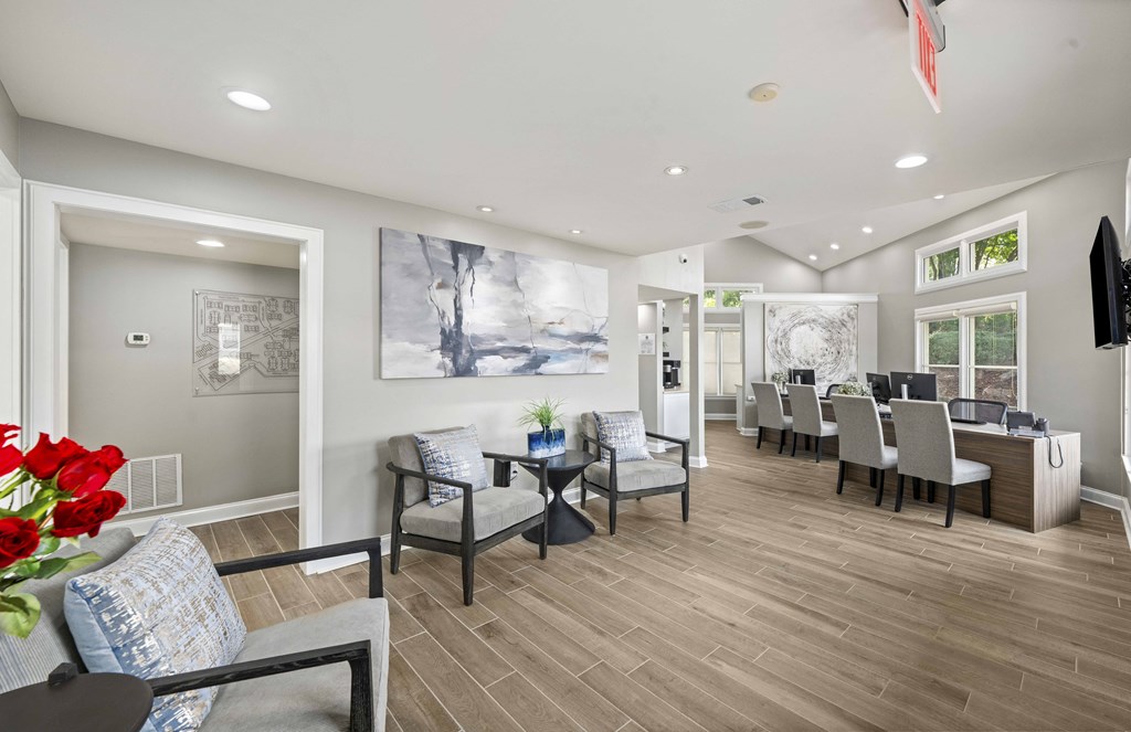 a living room with a dining room table and chairs