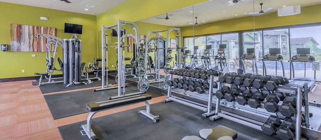 the gym at the flats at big tex apartments