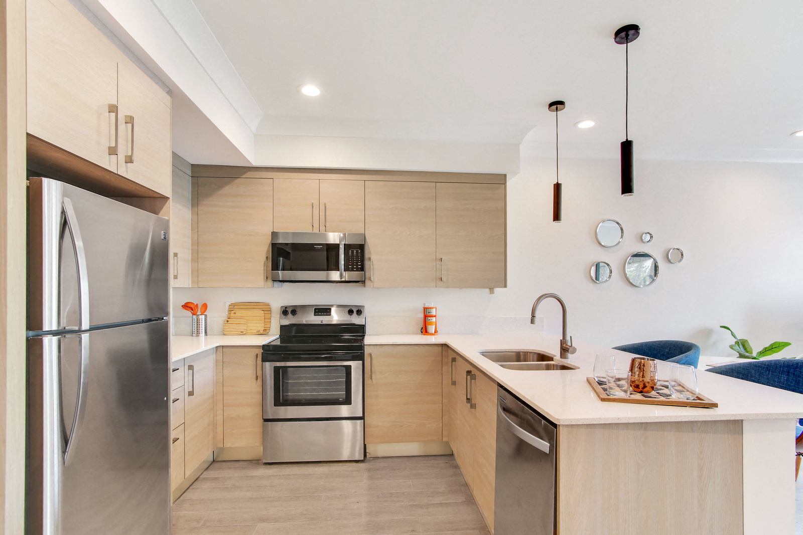 a kitchen with wooden cabinets and stainless steel appliances