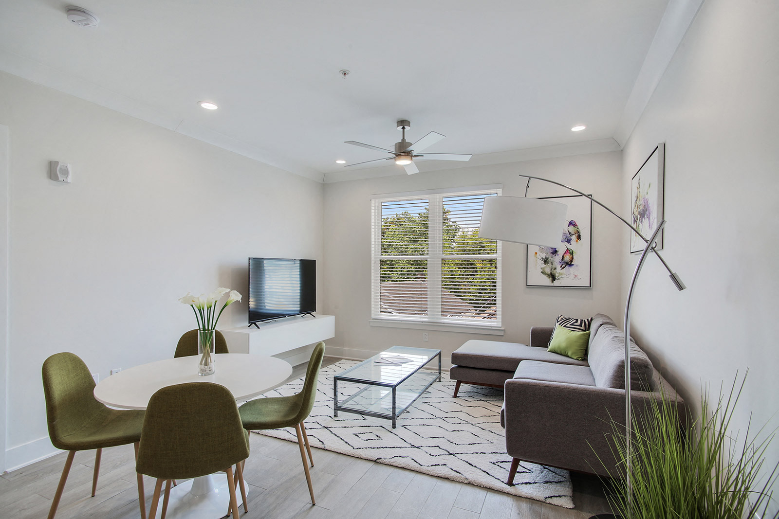 a living room with a couch and a table and a tv