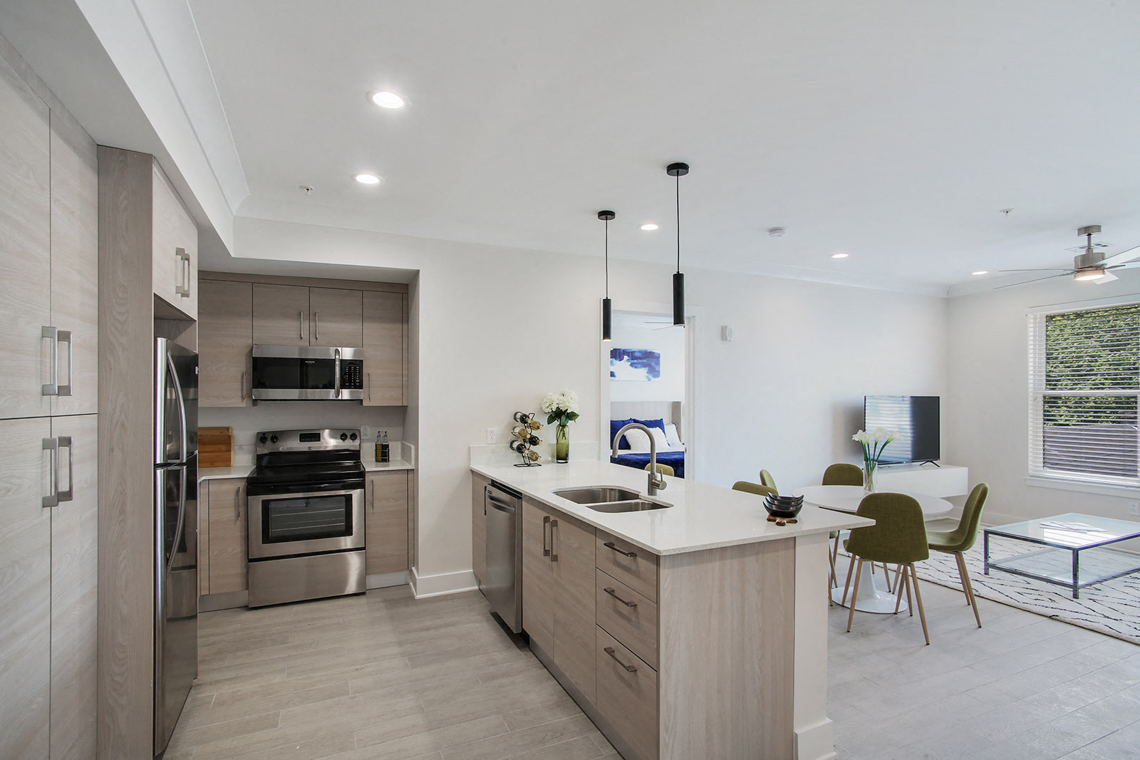 an open kitchen and dining area with a table and chairs