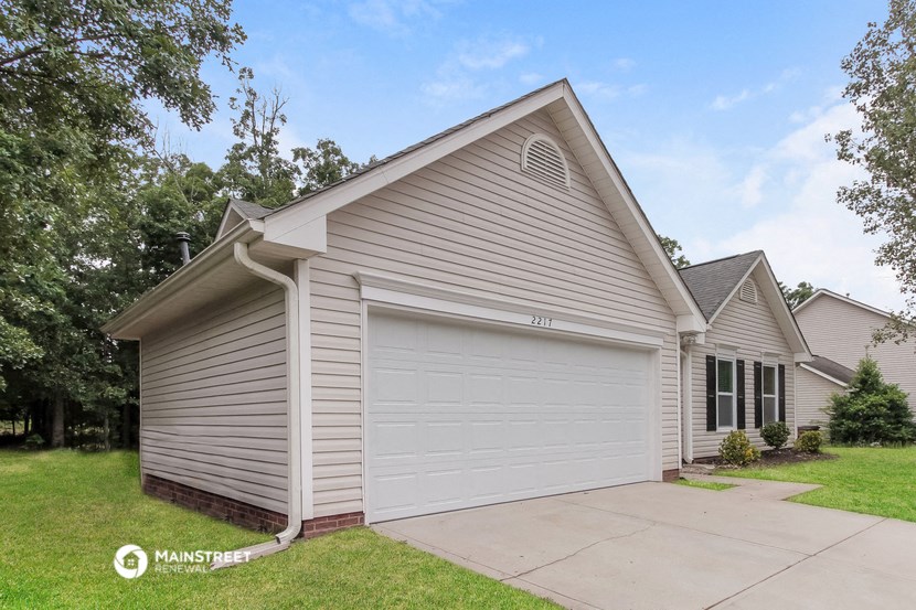 a white garage door on the side of a house