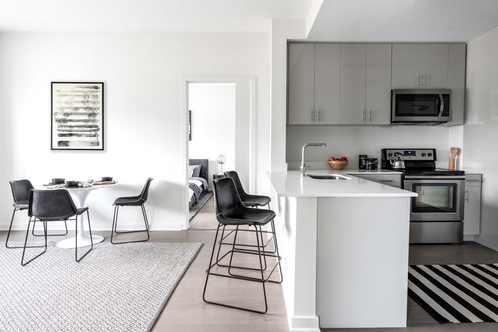 a white kitchen with a white counter top and a white