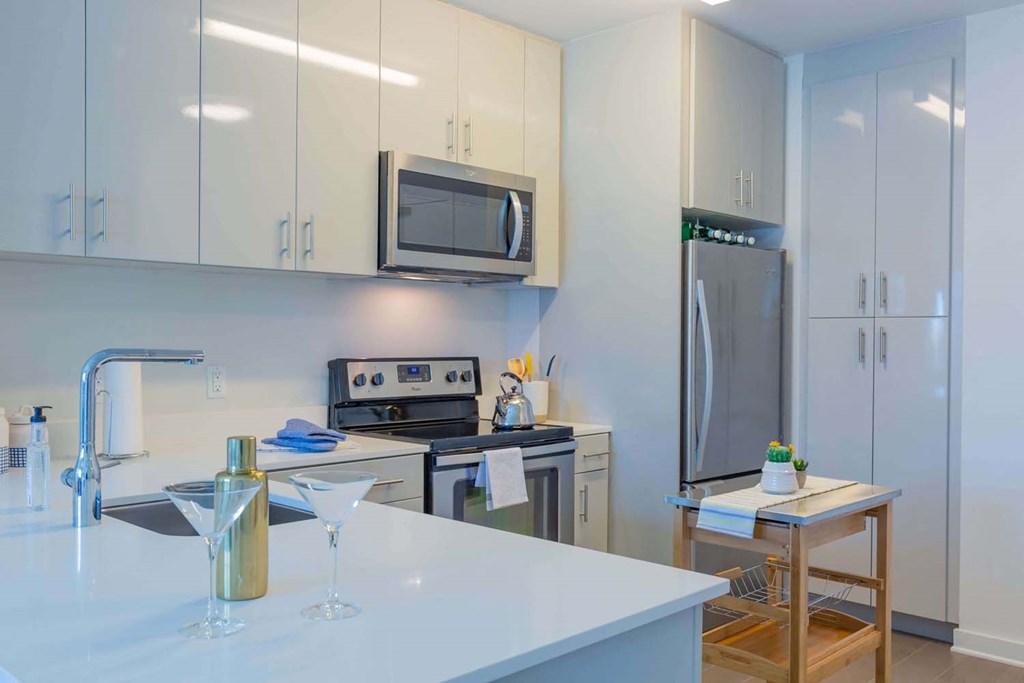 a kitchen with a counter top and a refrigerator
