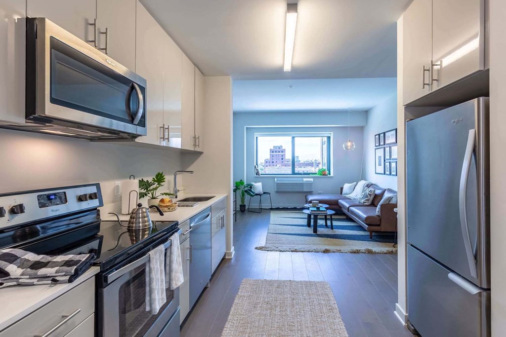 a kitchen with stainless steel appliances and a window
