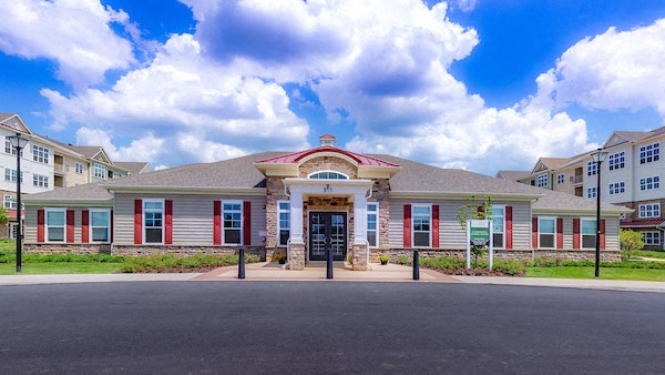 the front of a building with a street in front of it