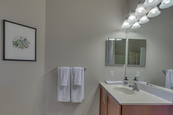 a small bathroom with a sink and a mirror