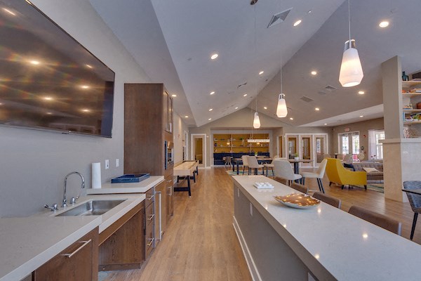 a large kitchen with a dining area and a living room