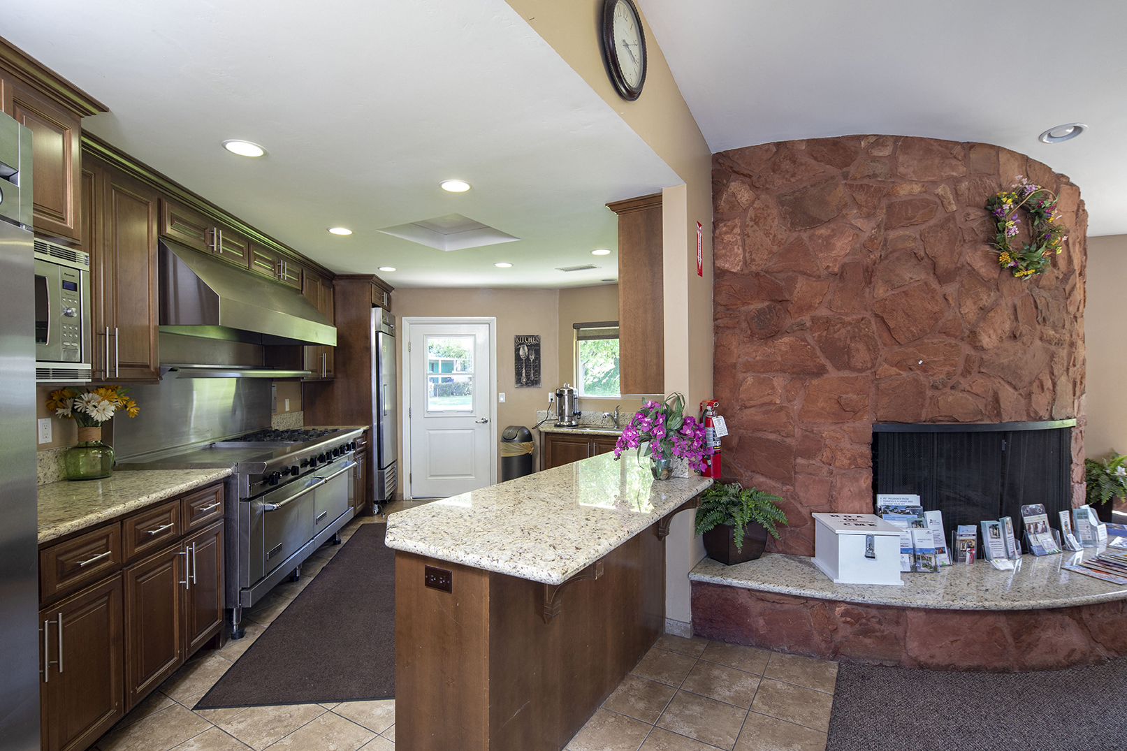 View of community clubhouse kitchen and fireplace