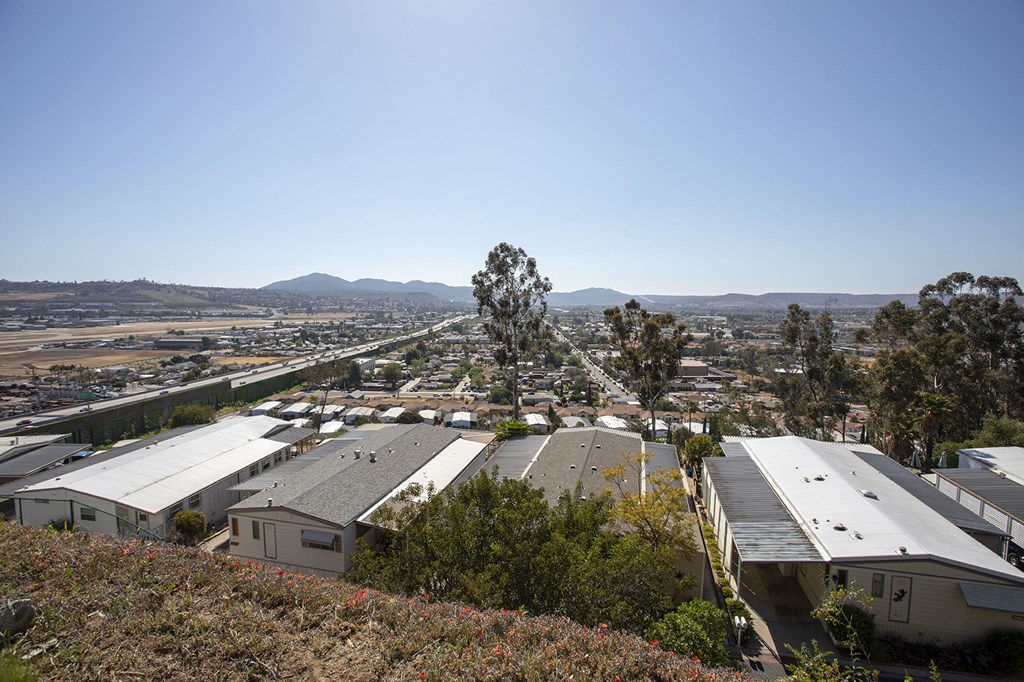 a view of a suburb of a city from a hill