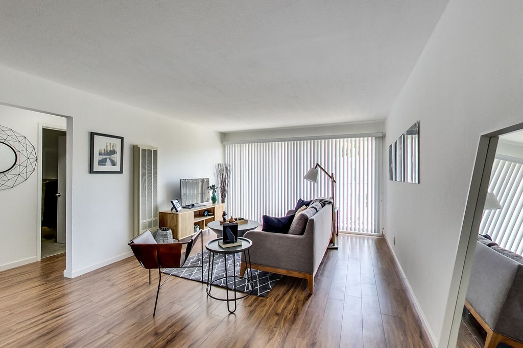 a living room with a couch and a table and a tv
