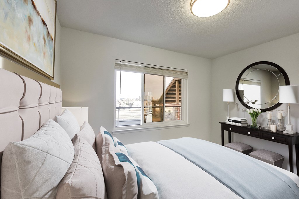 a bedroom with a large bed and a window