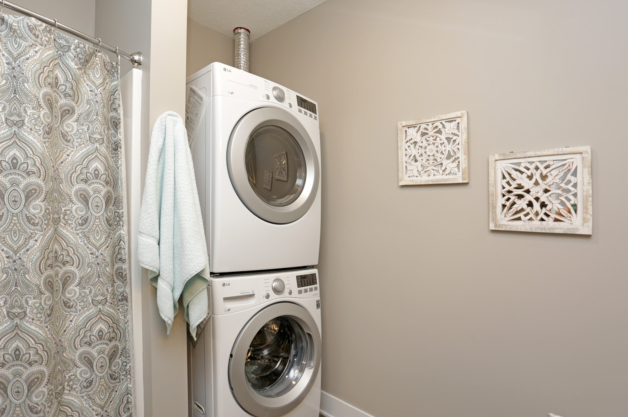 a small laundry room with a washer and dryer in it