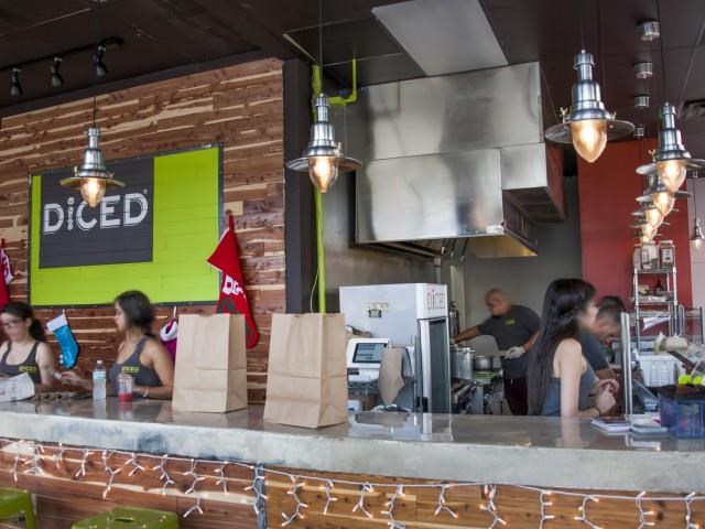 a group of people are in a diner