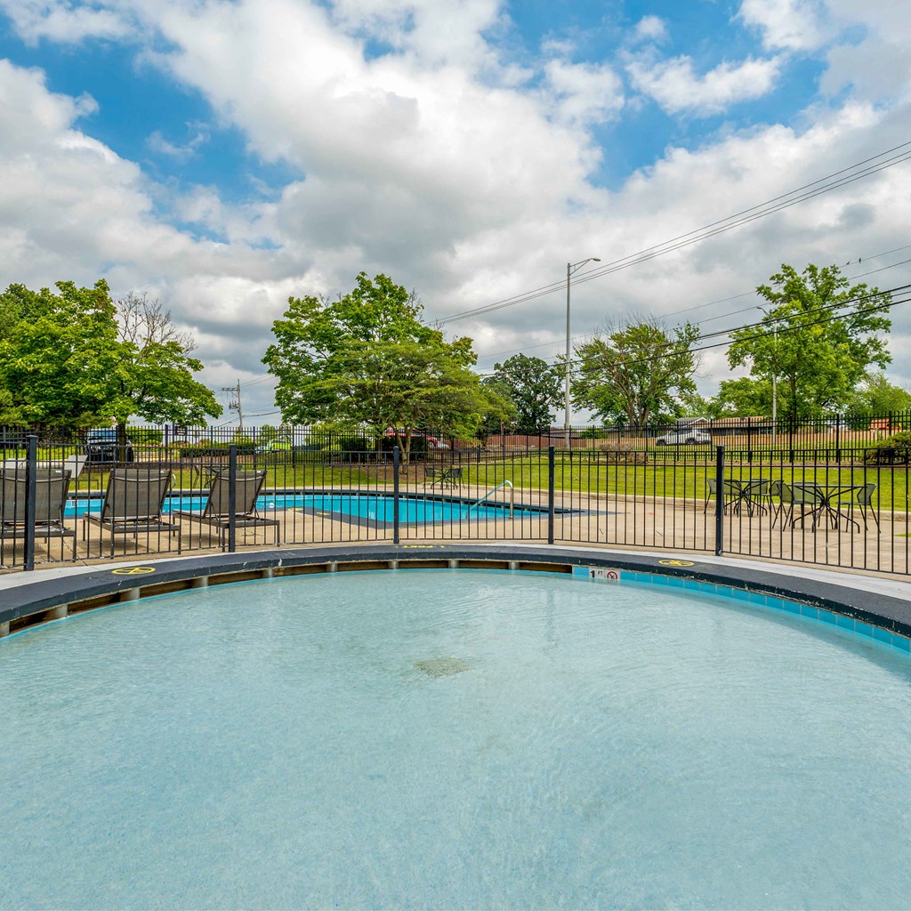 the swimming pool at the preserve at polo towers has a fence and a pool